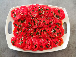 Tomato salad with aromatic herbs.