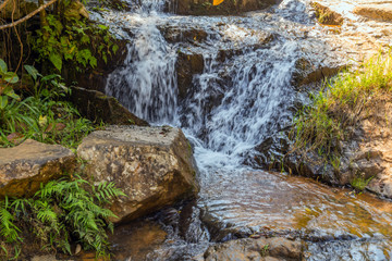 waterfall cascade detailed texture of flowing water on mountain landscapes