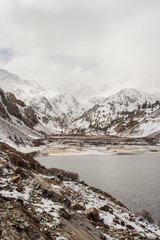 Snow covered mountains with a lake in the foreground in California. 