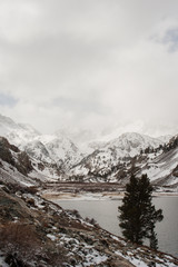 Snow covered mountains with a lake in the foreground in California. 