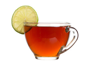 Tea with lemon in a transparent cup, white background