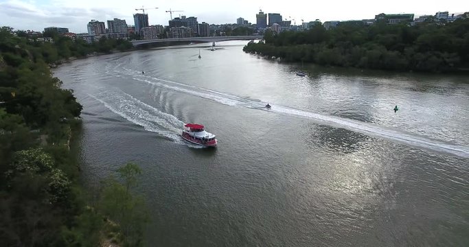 Boat and jet ski on Brisbane river