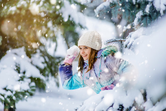 Cute Girl Ready To Throw Snowball During Day