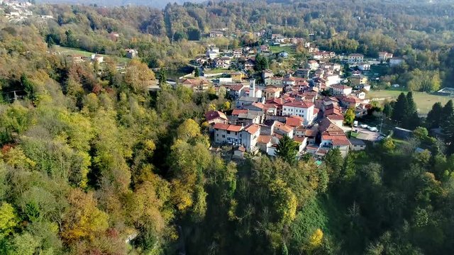 Aerial view of Ferrera di Varese on the hills north of Varese, with Fermona waterfall below, Italy
