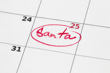 Sheet of wall calendar with red mark on 25 december - Christmas, written Santa