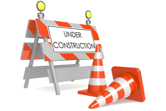 Under construction sign with traffic cones