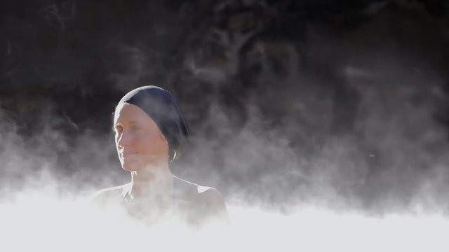 Woman in hot spring geothermal pool