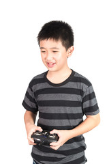 Asian boy holding radio remote control handset for helicopter, drone or plane, isolated on white background.