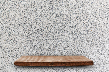 Empty top of wood shelves on the white terrazzo stone wall background. For product display.