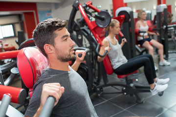 sport people working out muscles on weight lifting gym machine