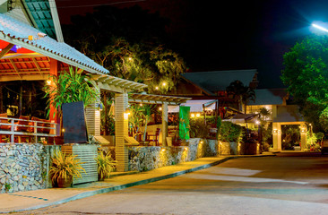 Typical restaurant in a luxury resort in Thailand. Night view, illumination of buildings