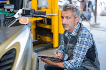 mechanic writing a report