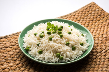 Basmati Rice Pilaf or pulav with Peas, or vegetable rice using green peas also known as matar pulav, served with plain dal   © StockImageFactory