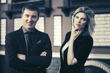 Young fashion business couple at office building