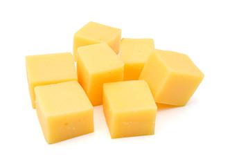 Cubes of cheddar cheese isolated on white