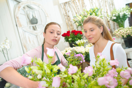 Florist selecting roses for customer
