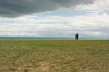 Fototapeta premium Mother and daughter by a lake