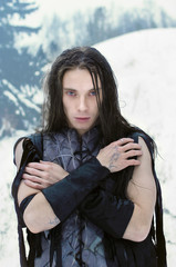 man in the suit an elf in the winter forest