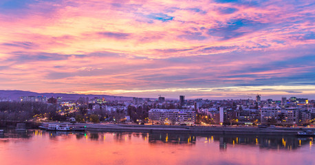 Fototapeta na wymiar Cityscape with sunset and clouds.