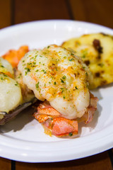 giant scallop with salmon and lobster tail