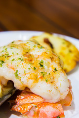 giant scallop with salmon and lobster tail
