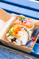 a giant sushi with soy sauce