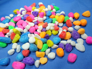 colourfull river stone in blue background