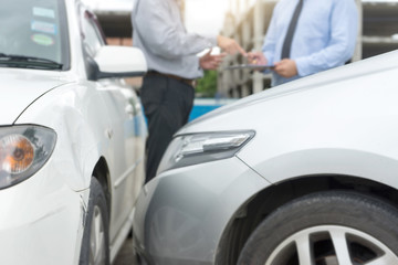 On the road car accident insurance agent examining carcrash