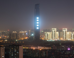 Fototapeta na wymiar Aerial night view of Hankou district of Wuhan city in China with in middle the 438 m high supertall building Wuhan Center Tower