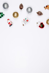 Fototapeta na wymiar Christmas holiday background. Santa claus, Reindeer, Snowman and decorative christmas ornaments on a white background with copy-space. Top view.
