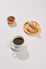Breakfast with bread and black coffee composition.