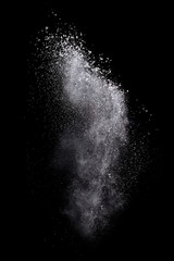 Fototapeta na wymiar Freeze motion of colored powder explosions isolated on black background.
