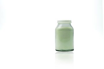 Green lemon flavored effervescent powders in transparent glass bottle with blank label and copy...