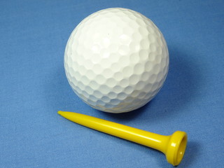 Golf ball on blue background