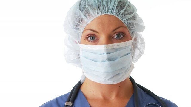 Closeup Of Young Woman Pulling Surgeon Mask Down From Face