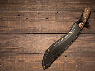 Machete on a wooden table