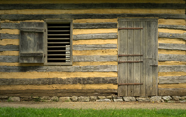 Fototapeta na wymiar Wall of a Log Cabin with Doorway