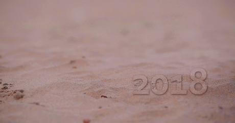 Closeup beach sand background, closeup of sand pattern of a beach in the summer
