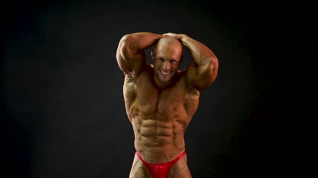 bodybuilder posing in studio