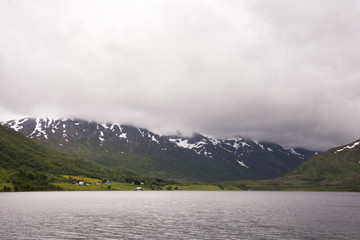 dirt road with curves on the sea towards Nyksund village in Norway