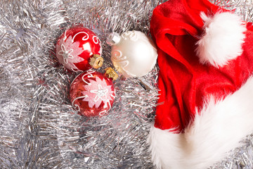 New year christmas decoration on silver background with santa hat top view