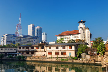 Obraz premium Colombo, Sri Lanka - 11 February 2017: Panoramic view on old Young men's Buddhist assiciation and towers skyscrapers of World Trade from Srilanka Custom's Head office