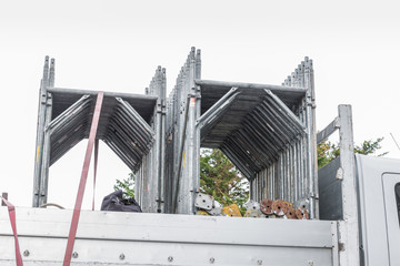 Components of a scaffolding on a truck. Steel scaffolding used for work on construction sites