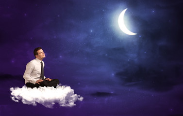 Obraz na płótnie Canvas Man sitting on cloud