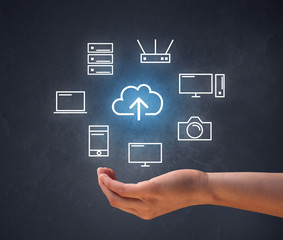 Hand holding technology related icons