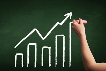 Hand drawing graph on blackboard