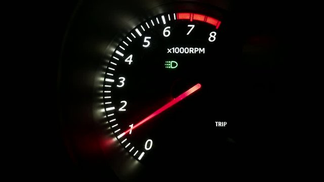 Car tachometer at night