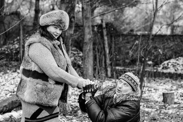 A mature man asks forgiveness from his wife. Background of nature in winter
