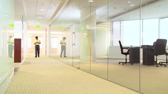 Office worker texting in hallway
