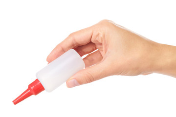 White glue container in hand isolated on a white background